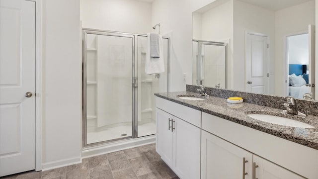 bathroom featuring vanity and an enclosed shower