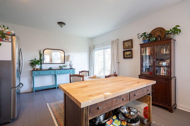 dining space featuring dark wood-type flooring