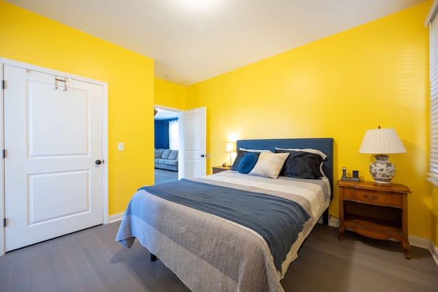 bedroom with hardwood / wood-style floors