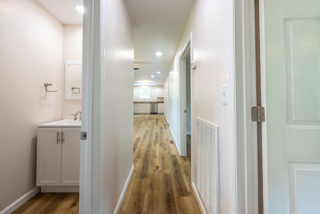 hallway with wood-type flooring