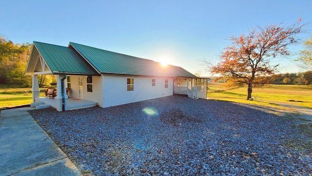 view of side of home featuring a porch