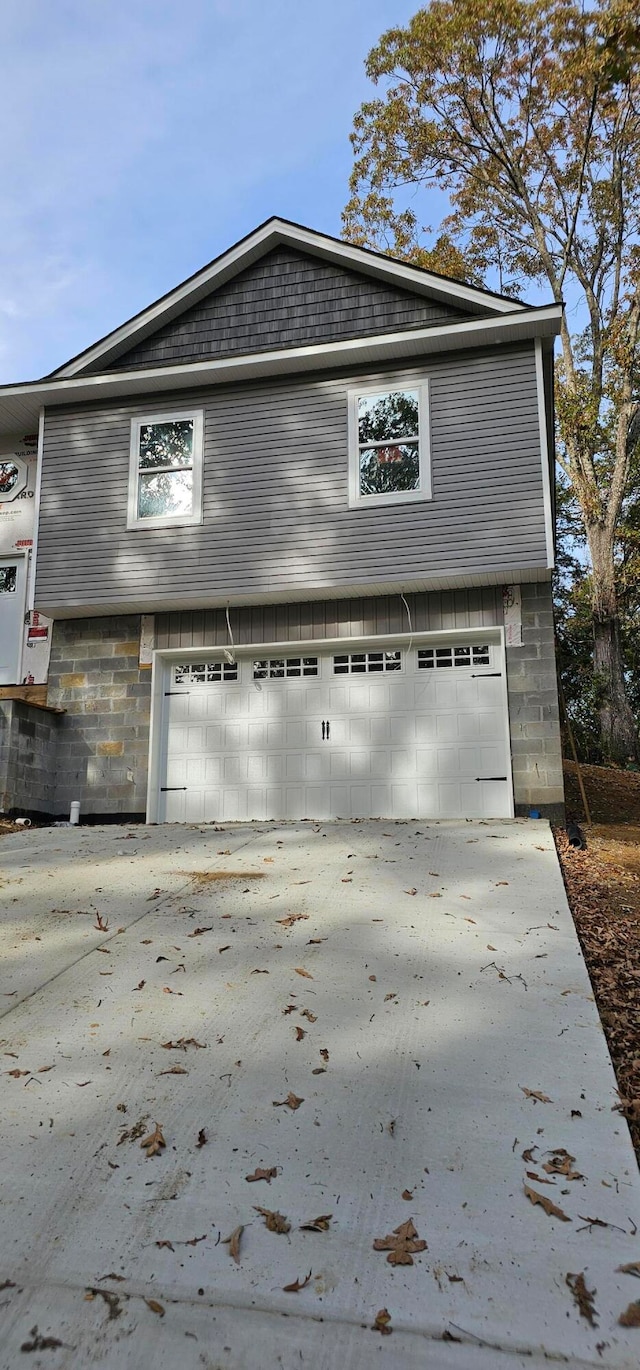 view of side of property featuring a garage