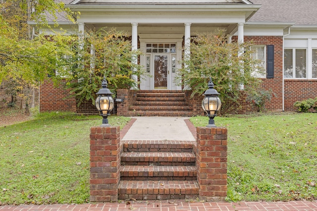 property entrance with a yard