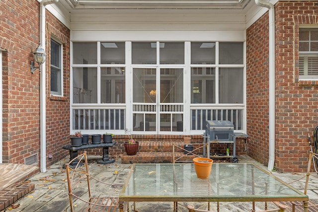 view of patio / terrace with a sunroom