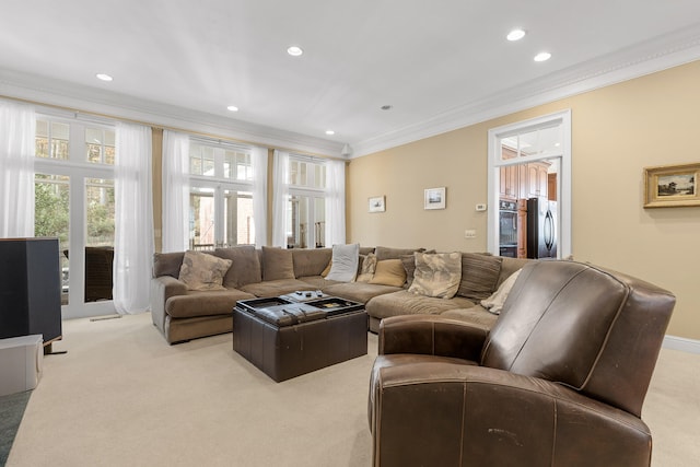 living room with light colored carpet and ornamental molding