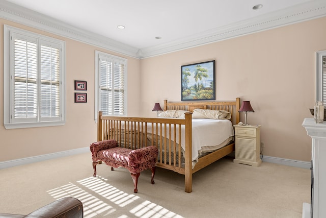 bedroom with crown molding and light colored carpet