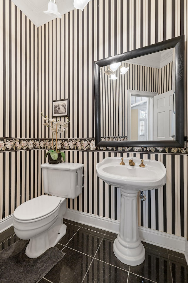 bathroom with tile patterned floors and toilet