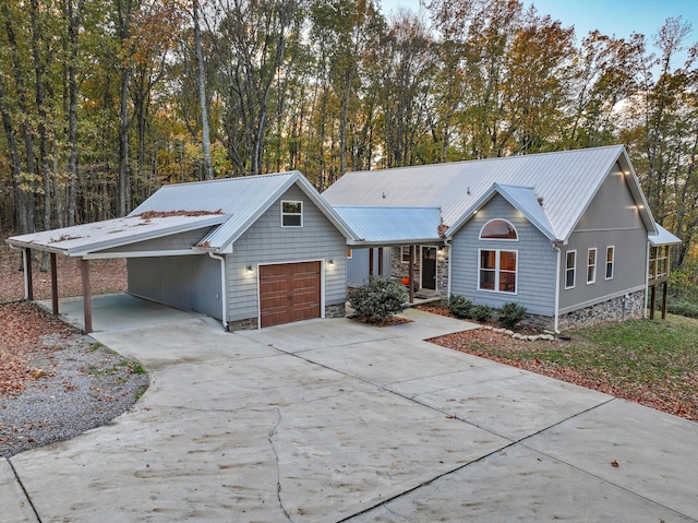 ranch-style house with a garage and a carport