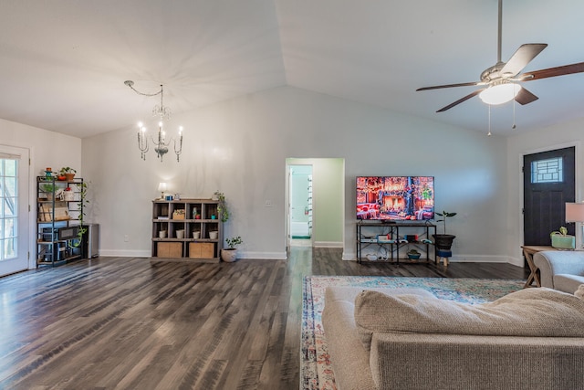 living room with ceiling fan with notable chandelier, dark wood-type flooring, and vaulted ceiling