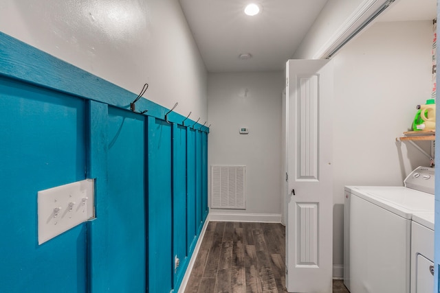 washroom featuring washer and clothes dryer and dark hardwood / wood-style floors