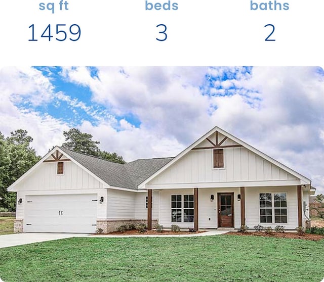 view of front of home with a garage and a front yard