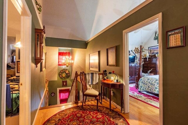 interior space with hardwood / wood-style floors and lofted ceiling