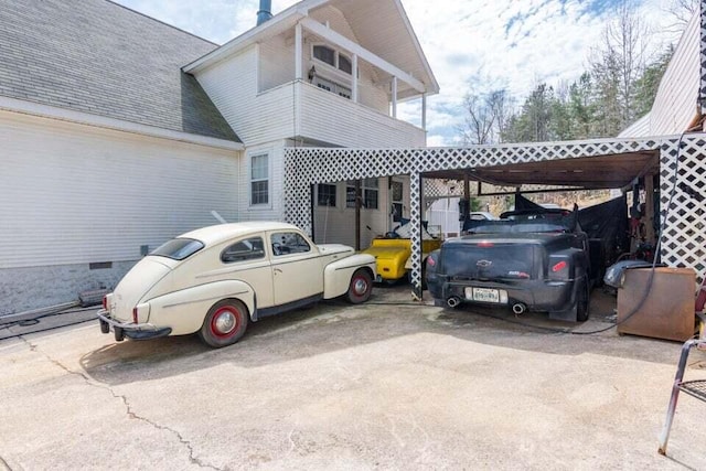 exterior space with a carport