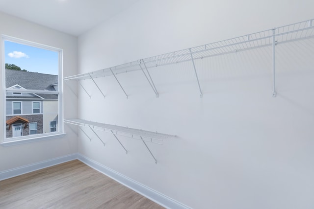 walk in closet featuring hardwood / wood-style floors