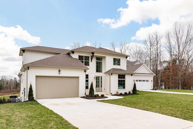 view of front facade featuring a front yard and a garage