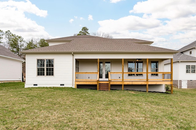 rear view of property with a lawn