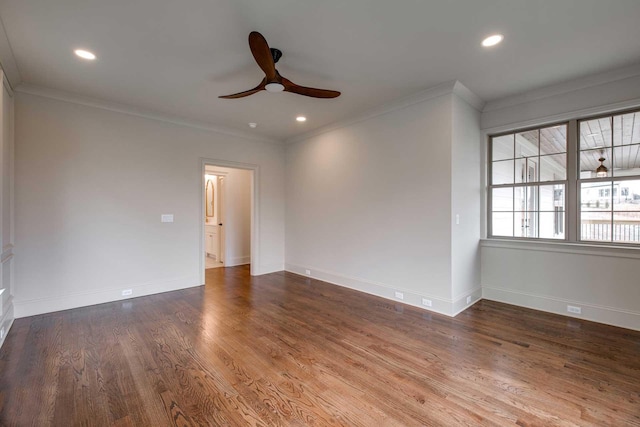 spare room with ceiling fan, wood-type flooring, and crown molding