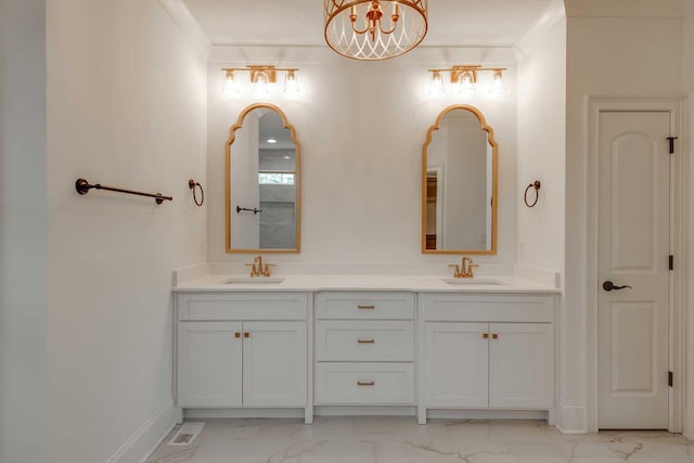 bathroom featuring a notable chandelier and vanity