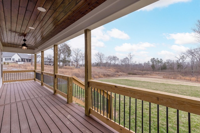 deck featuring a lawn and ceiling fan