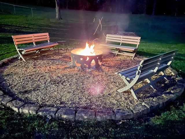 view of community with an outdoor fire pit