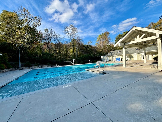 view of swimming pool featuring a patio area