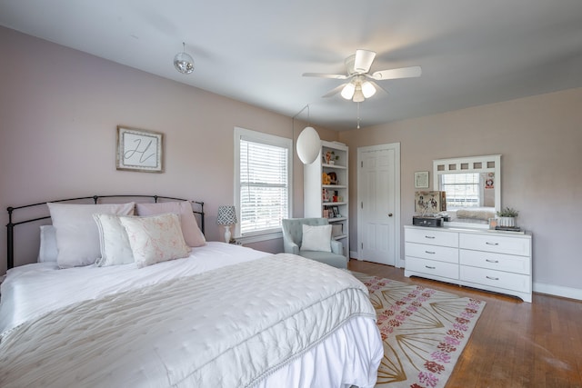 bedroom featuring dark hardwood / wood-style floors and ceiling fan