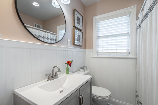 bathroom featuring vanity and toilet