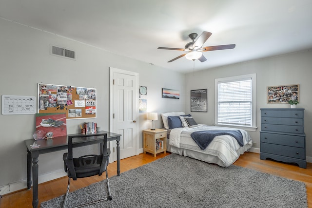 bedroom featuring light wood-type flooring and ceiling fan