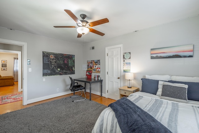 bedroom featuring hardwood / wood-style floors and ceiling fan