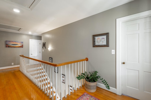 hall with hardwood / wood-style flooring