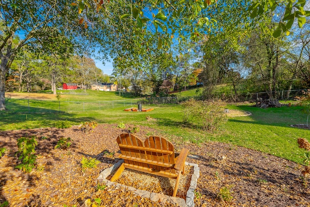 view of property's community with a lawn