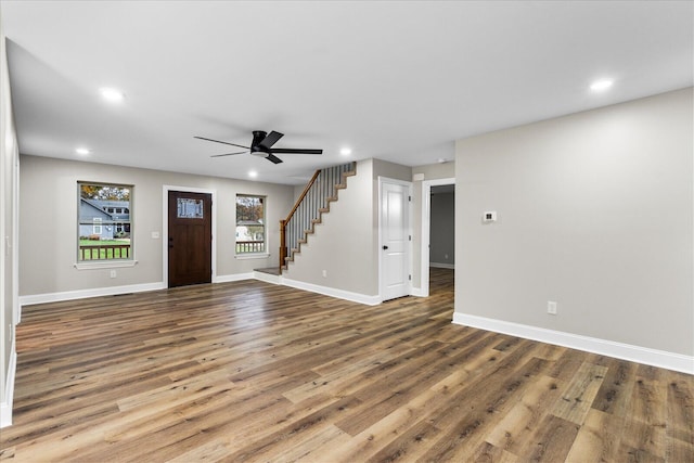 entryway with hardwood / wood-style flooring and ceiling fan