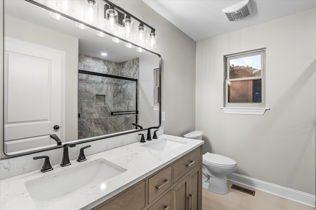 bathroom with vanity, toilet, and walk in shower