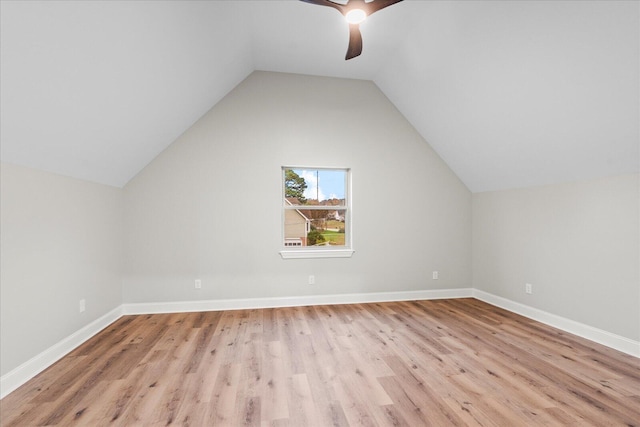 bonus room with light wood-type flooring, vaulted ceiling, and ceiling fan