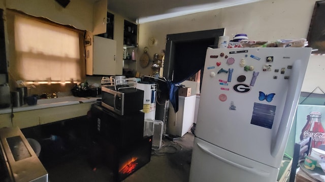 kitchen featuring white fridge