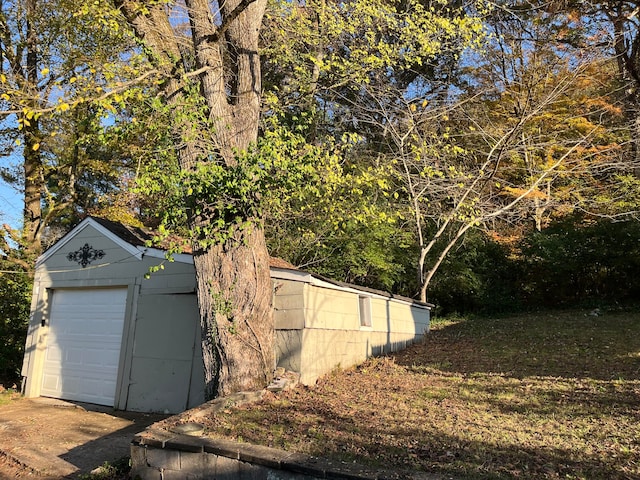 view of side of home with an outbuilding and a garage