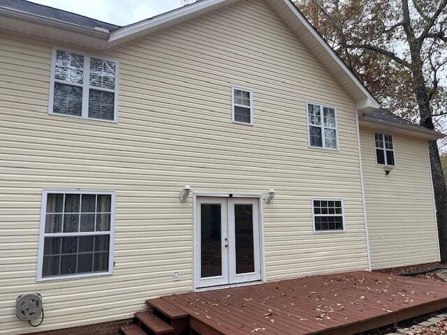 back of house featuring french doors and a deck