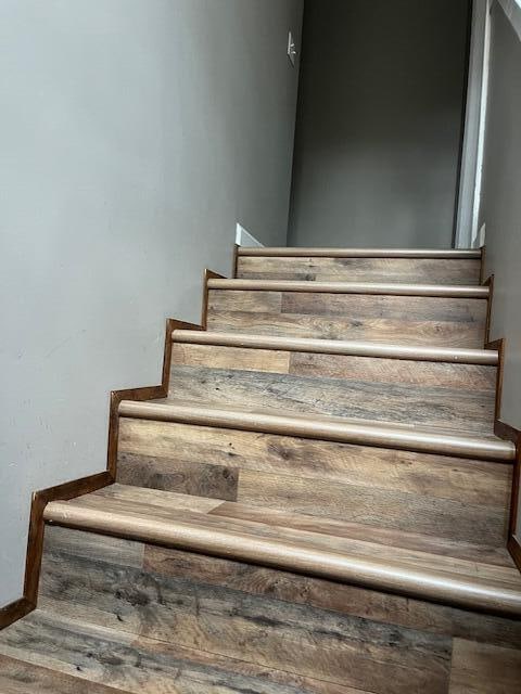 stairway featuring hardwood / wood-style flooring