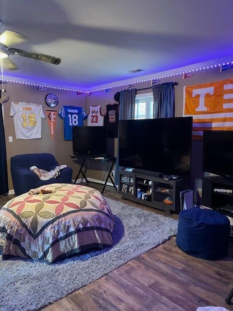 bedroom with wood-type flooring and ceiling fan