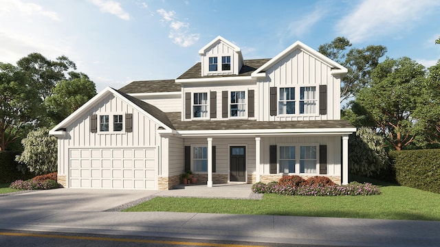 view of front of property with a front yard and a garage