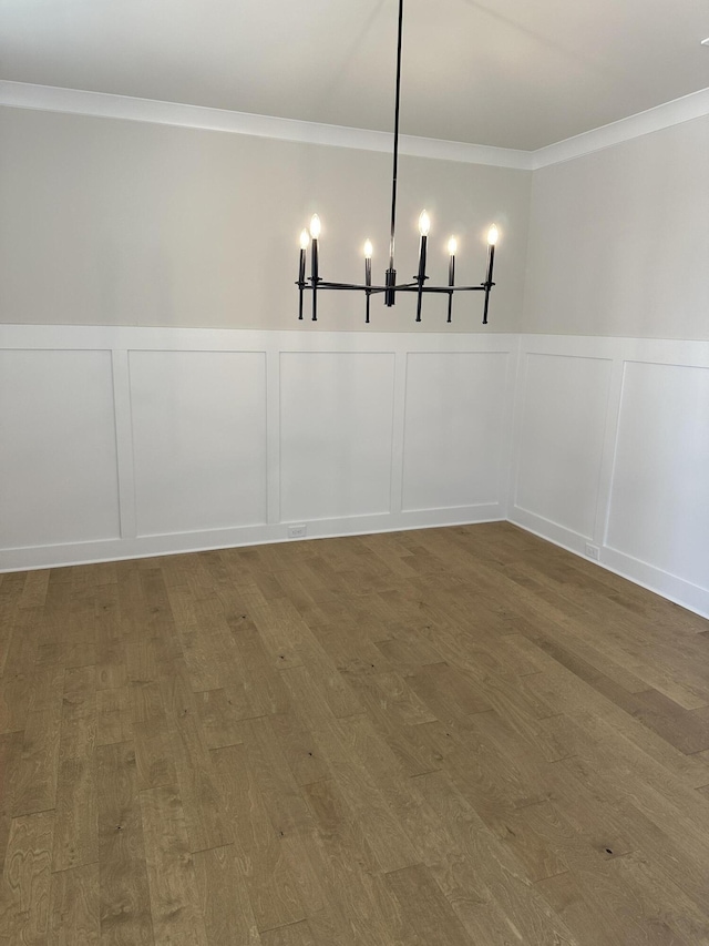 3349 Grassy Fields Ln Unit 177, Apison, TN 37302 - unfurnished dining area with a decorative wall, ornamental molding, wainscoting, wood finished floors, and a chandelier