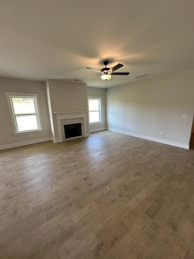3349 Grassy Fields Ln Unit 177, Apison, TN 37302 - unfurnished living room featuring wood finished floors, ceiling fan, baseboards, and a fireplace