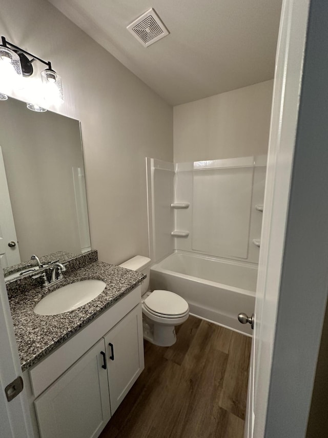 3349 Grassy Fields Ln Unit 177, Apison, TN 37302 - bathroom featuring wood finished floors, vanity, toilet, and washtub / shower combination