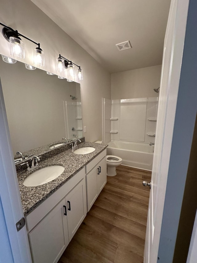 3349 Grassy Fields Ln Unit 177, Apison, TN 37302 - full bath featuring double vanity, wood finished floors, toilet, and bathing tub / shower combination