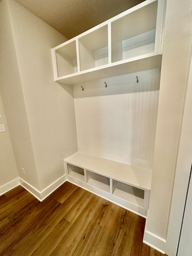 mudroom with dark wood-type flooring