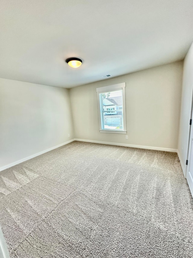 unfurnished room with carpet