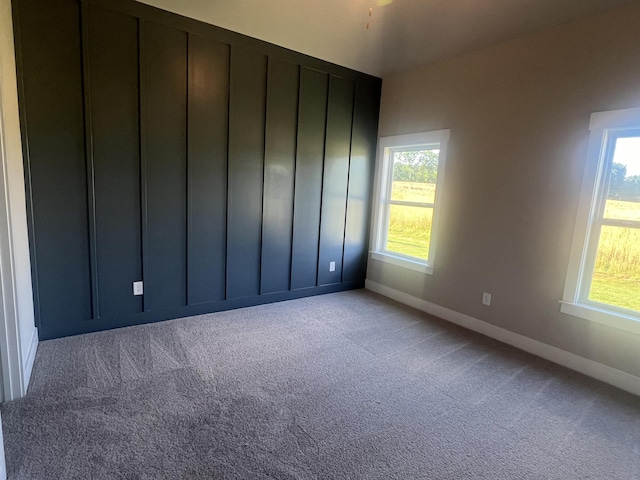 unfurnished room with light colored carpet