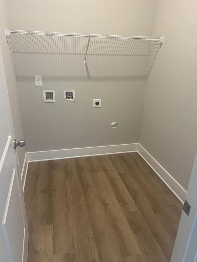 laundry area featuring hookup for an electric dryer, hookup for a washing machine, and dark hardwood / wood-style flooring