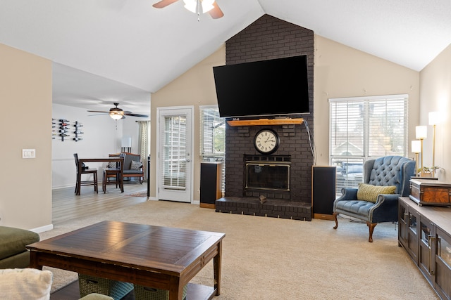 carpeted living room with plenty of natural light, ceiling fan, and a fireplace