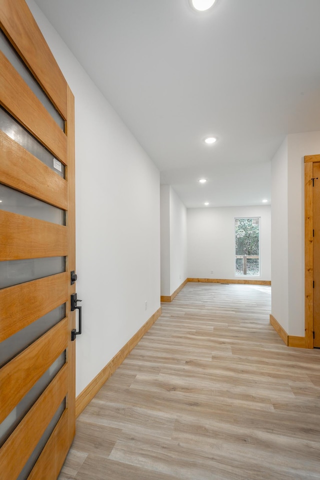 unfurnished room featuring light wood-type flooring